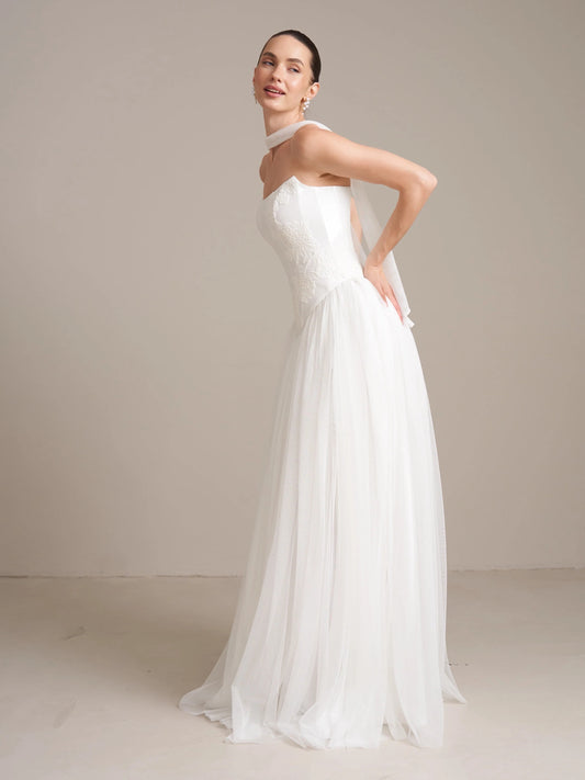 Ivory floor-length wedding dress, front view showing the a-line silhouette