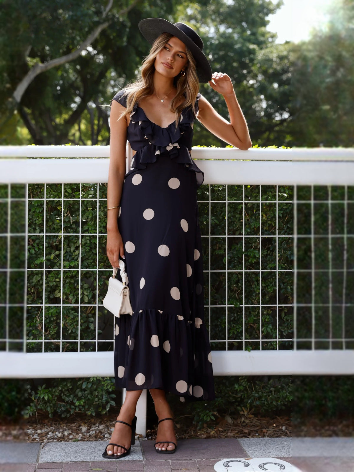 Black midi formal dress with printed pattern, full-length front view