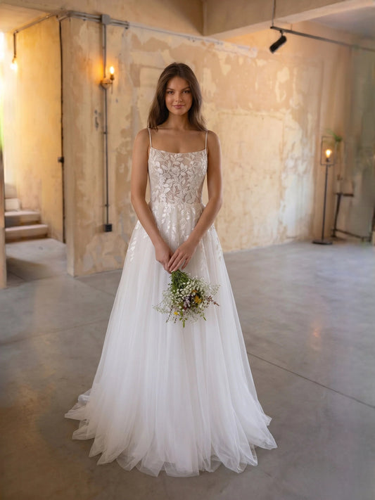 Ivory floor-length wedding dress, front view showing the a-line silhouette