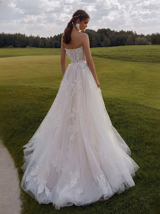 Ivory floor-length wedding dress, front view showing the a-line silhouette