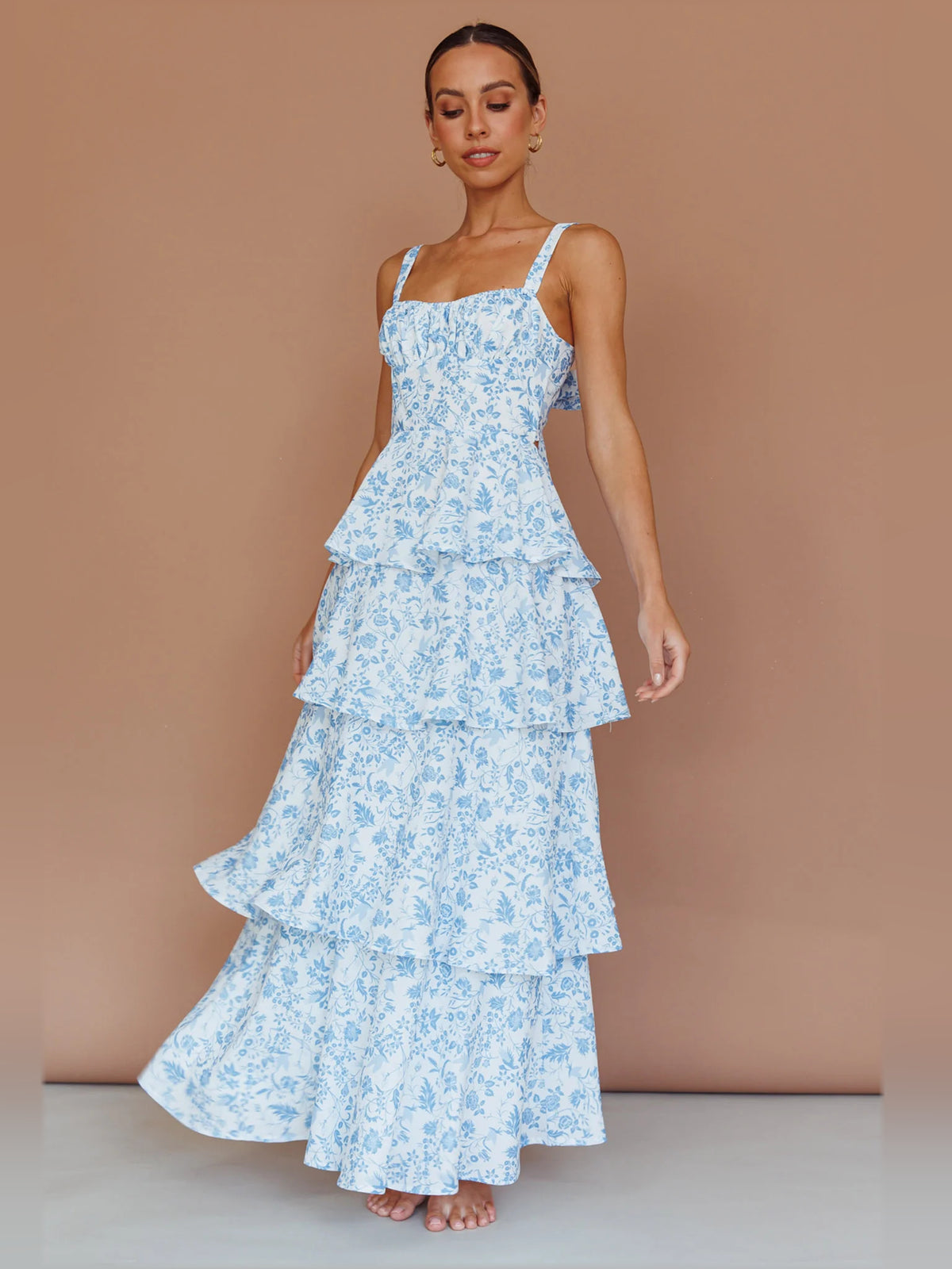 Blue midi formal dress with floral print, full-length front view