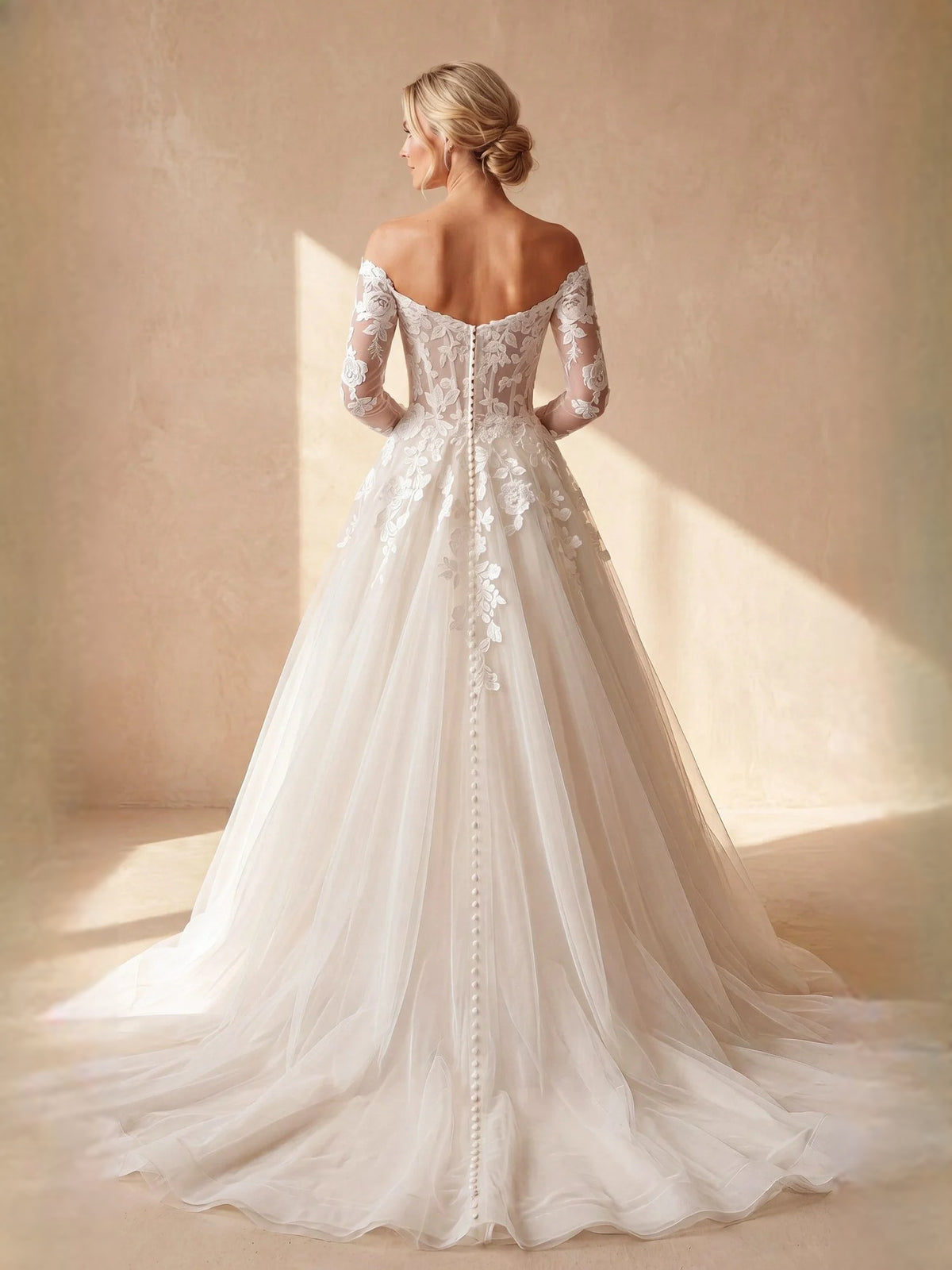 Ivory floor-length wedding dress, front view showing the a-line silhouette