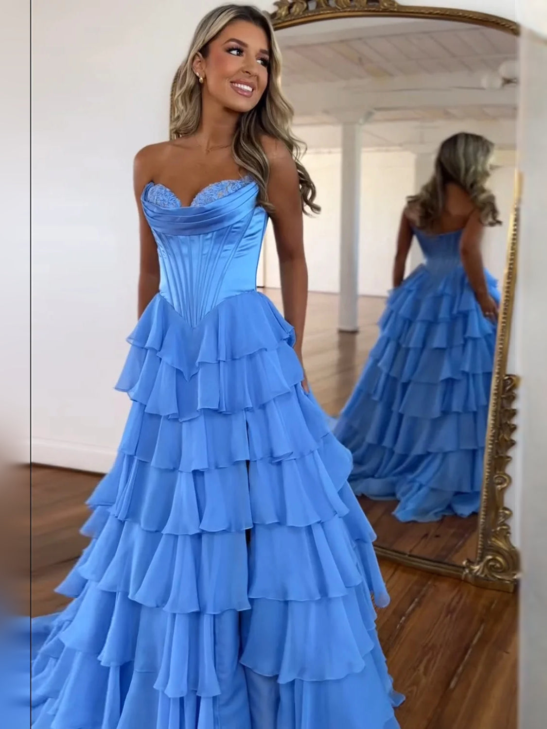 Blue floor-length prom dress, front view showing the a-line silhouette