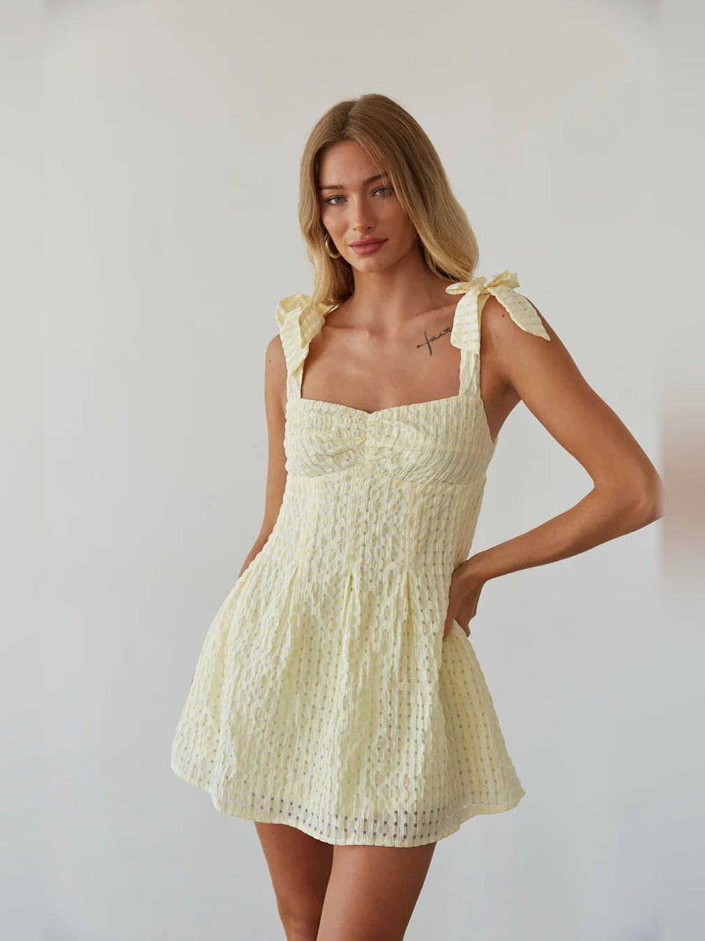 Gold mini homecoming dress, front view showing the silhouette