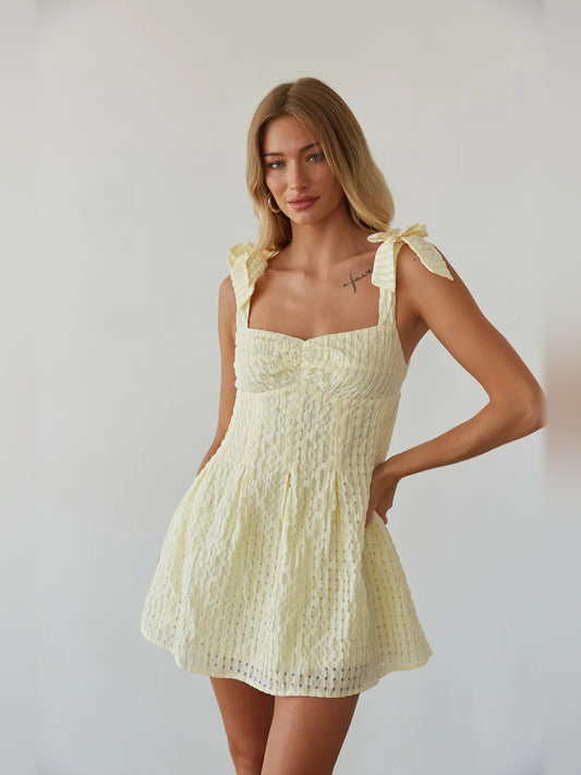 Gold mini homecoming dress, front view showing the silhouette