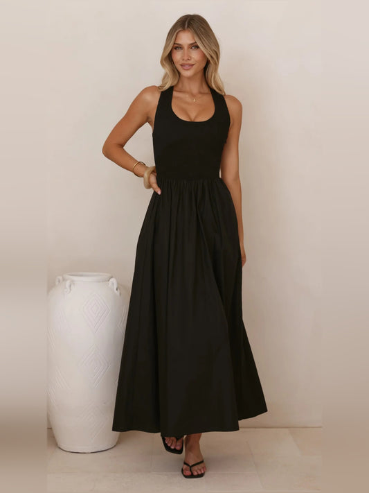 Black a-line maxi formal dress with halter neckline, full-length front view