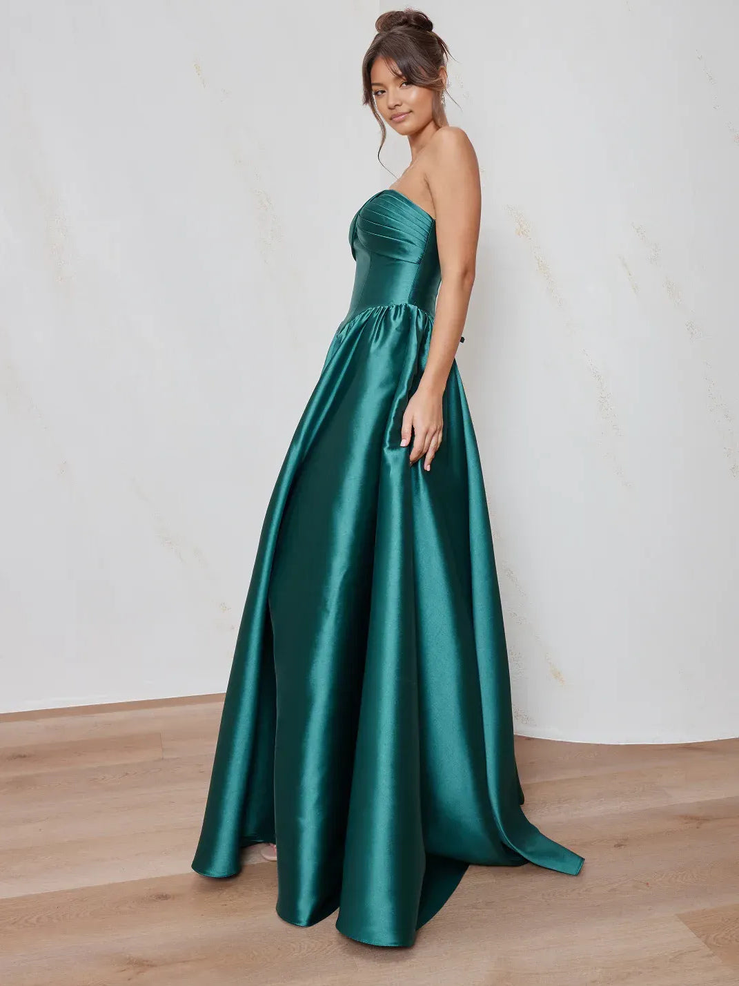 Teal floor-length prom dress, front view showing the a-line silhouette