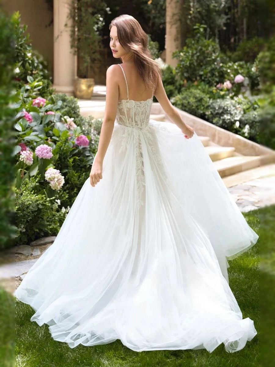 Ivory floor-length wedding dress, front view showing the a-line silhouette