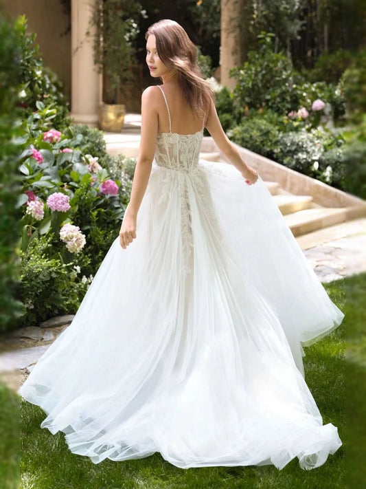 Ivory floor-length wedding dress, front view showing the a-line silhouette