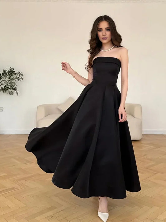 Black midi bridesmaid dress, front view showing the a-line silhouette