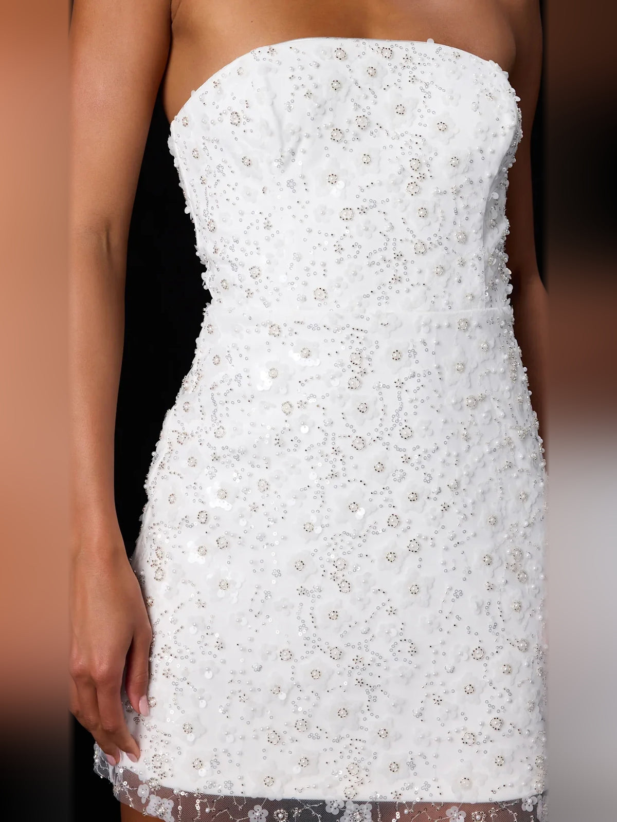 White mini homecoming dress, back view showing the rear of the dress