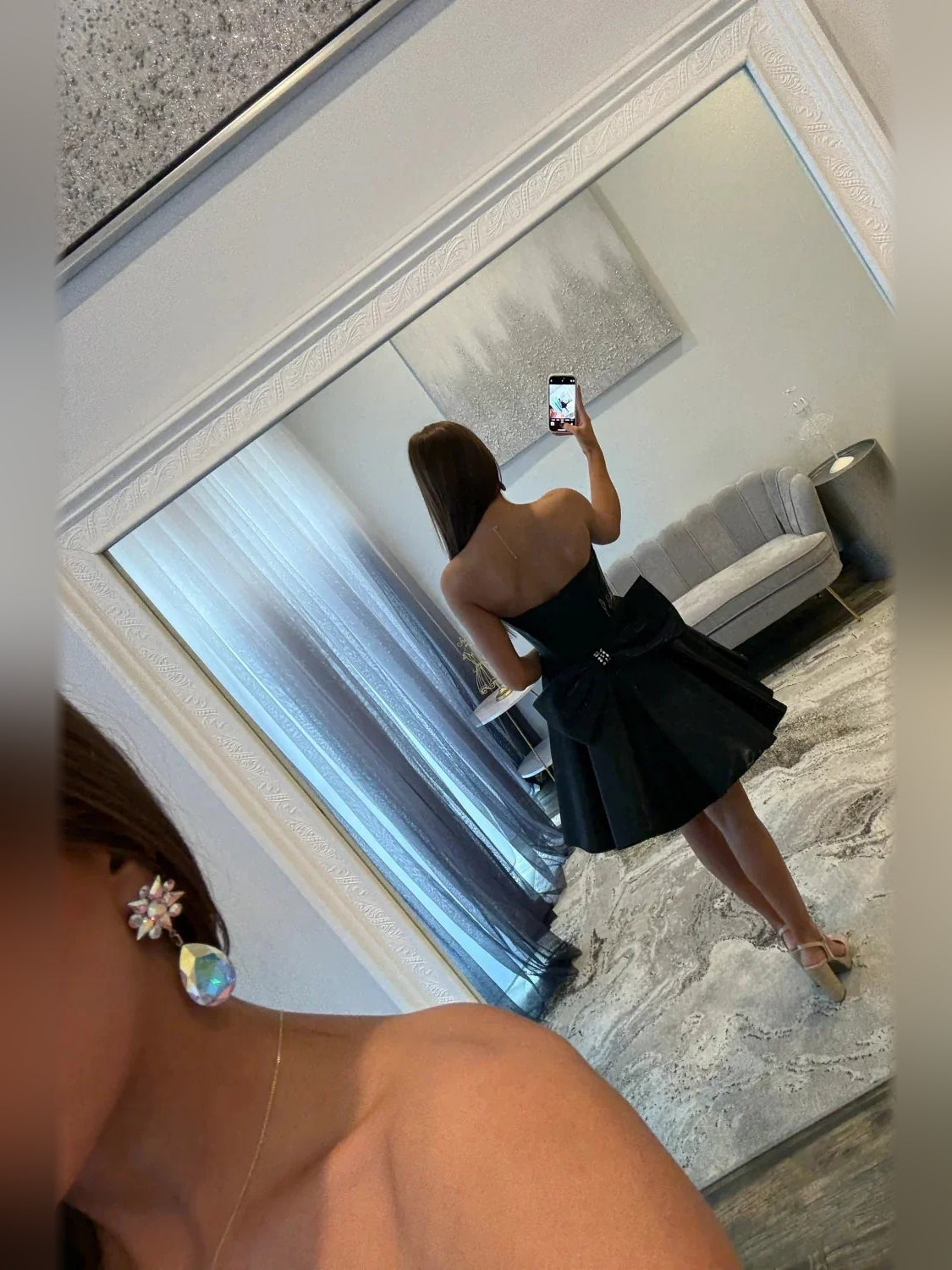 Black short homecoming dress, back view showing the rear of the dress