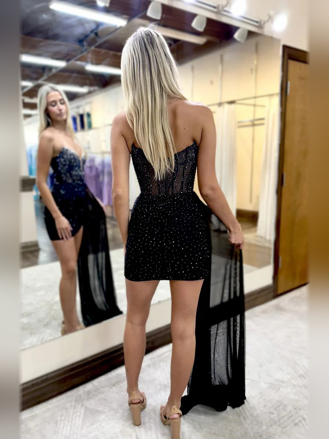 Black mini homecoming dress, back view showing the rear of the dress