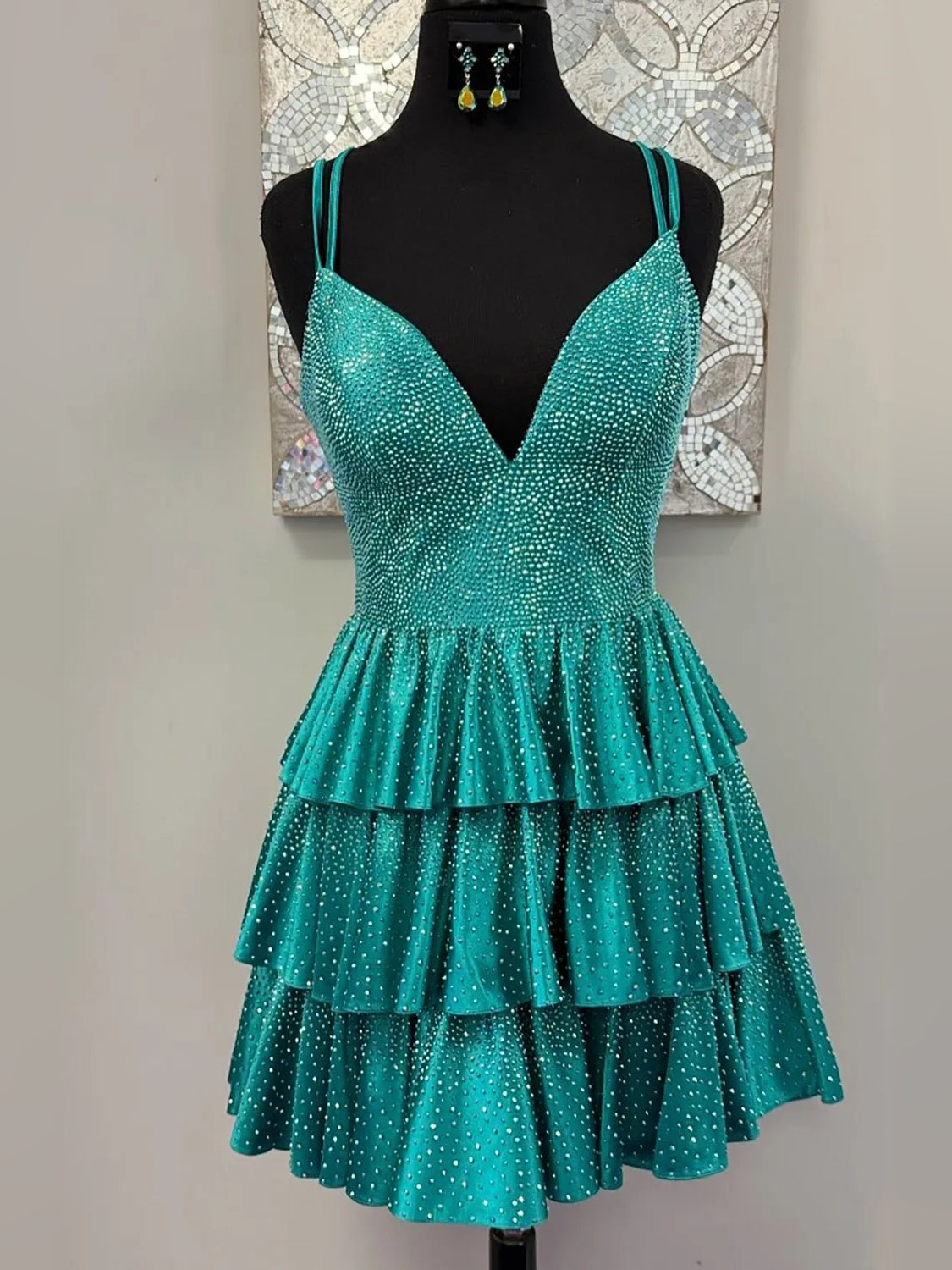 Turquoise short homecoming dress, back view showing the rear of the dress