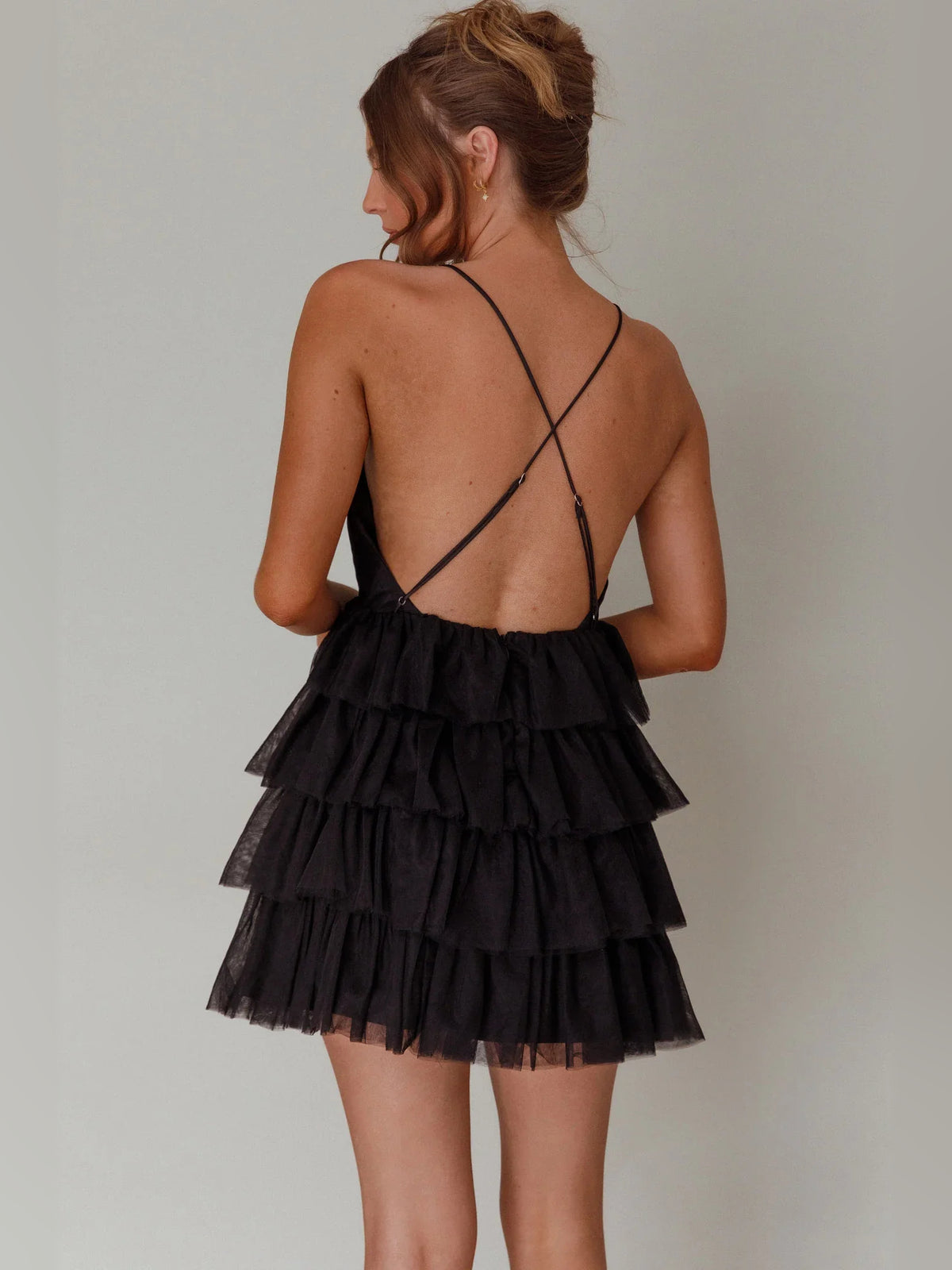 Black mini homecoming dress, back view showing the rear of the dress