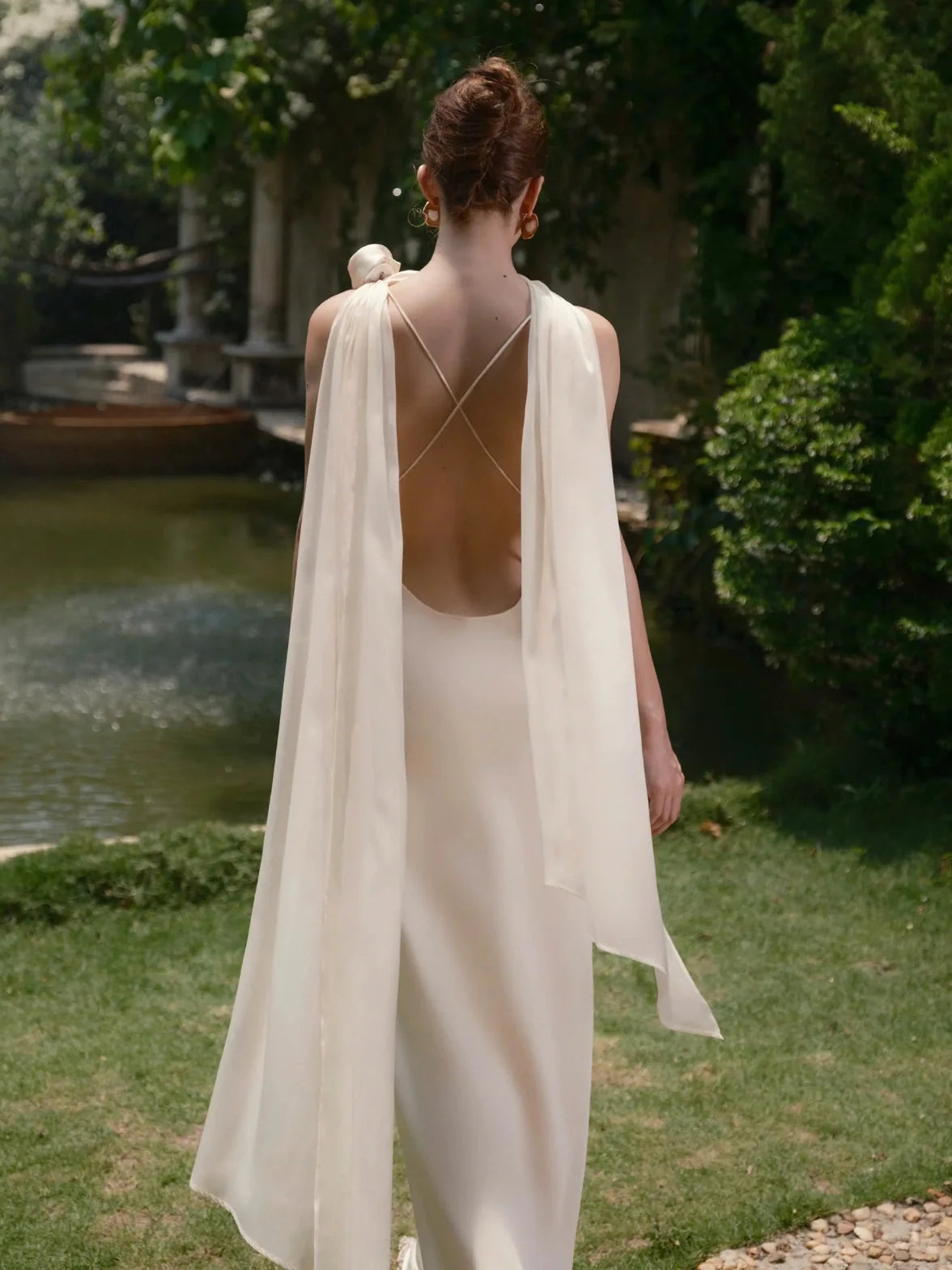 Ivory floor-length wedding dress, back view showing the rear of the dress