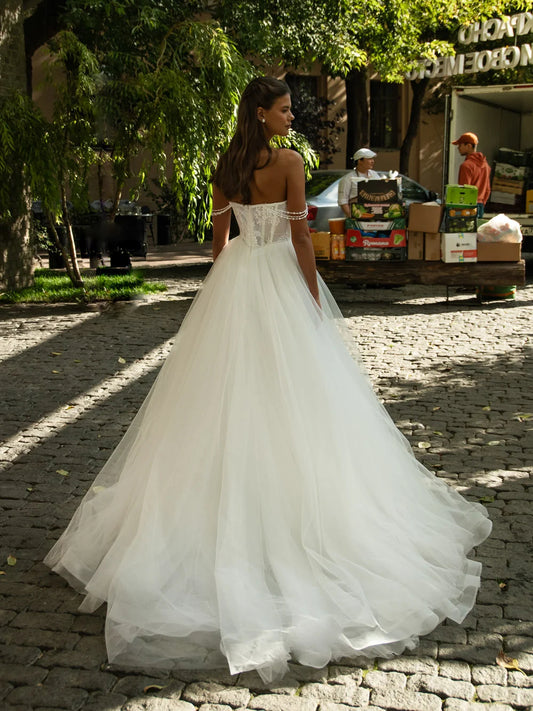 Ivory floor-length wedding dress, back view showing the rear of the dress