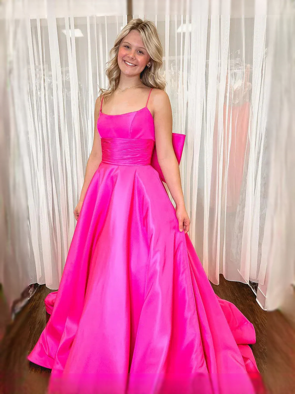 Fuchsia floor-length prom dress, back view showing the rear of the dress