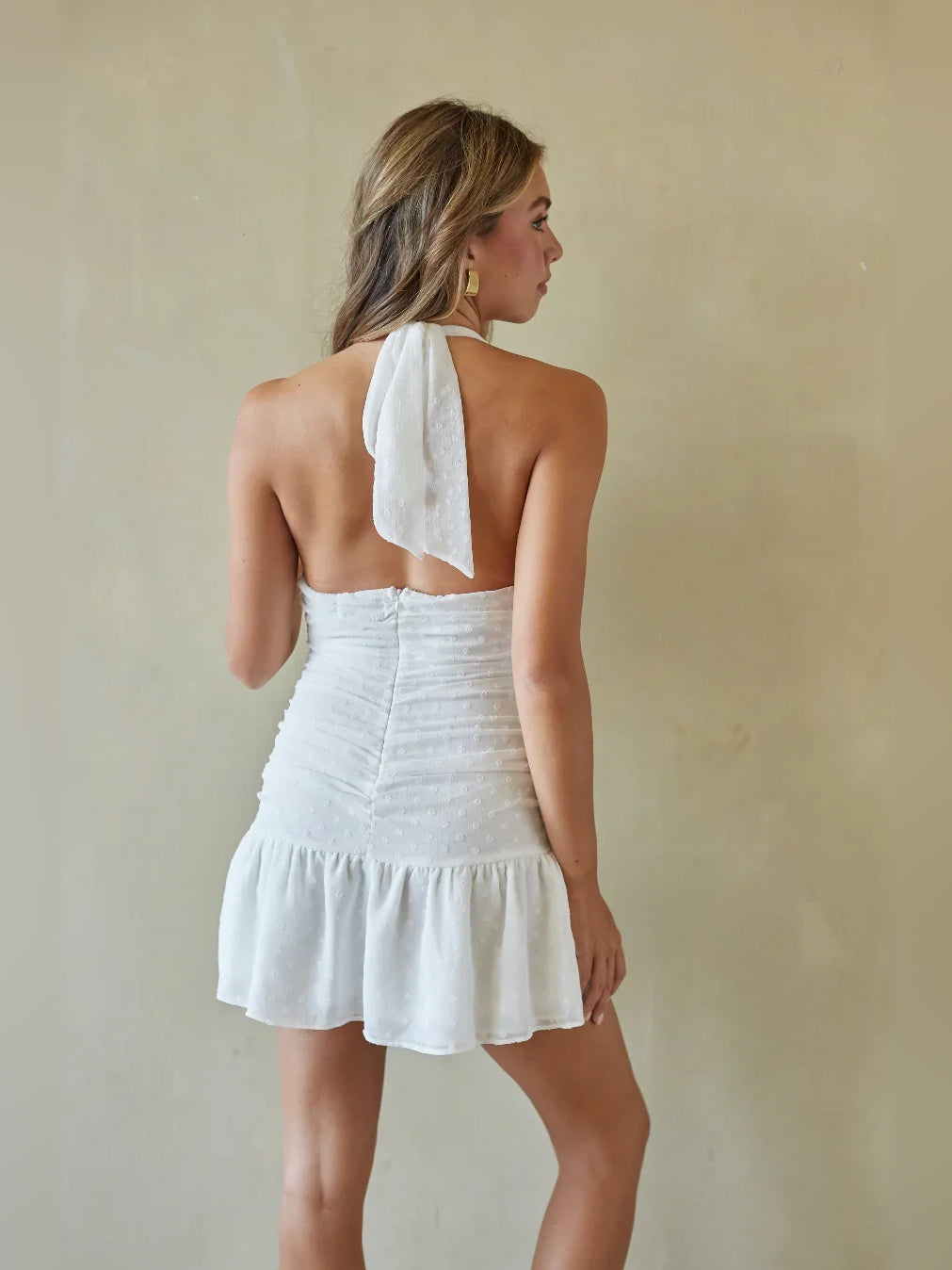 White mini homecoming dress, back view showing the rear of the dress