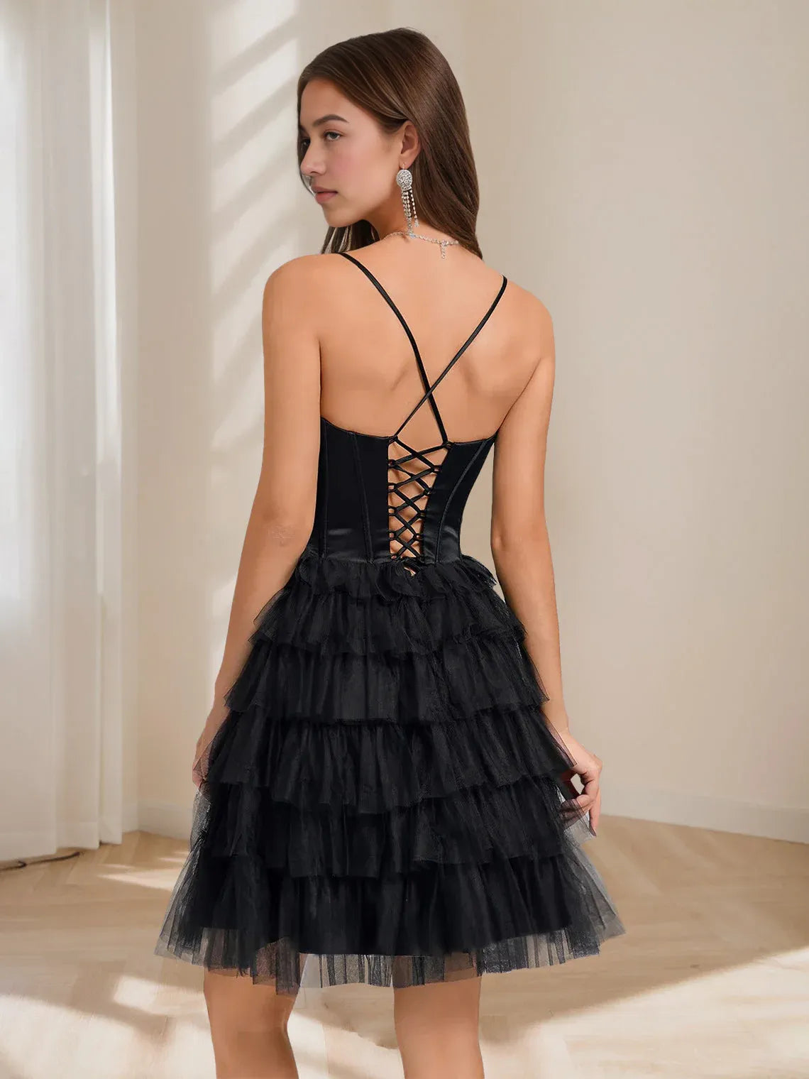 Black mini homecoming dress, back view showing the rear of the dress