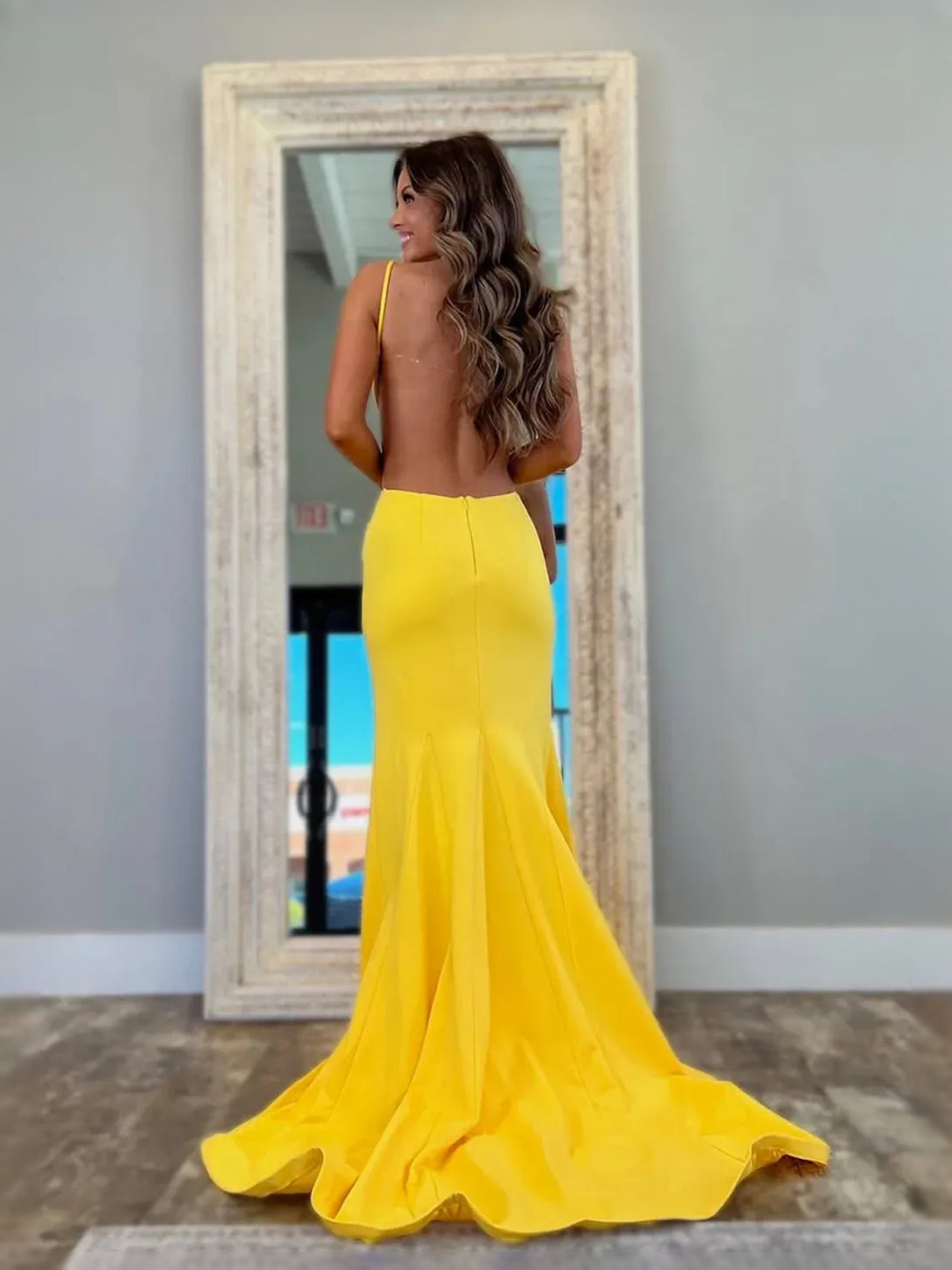 Yellow floor-length prom dress, back view showing the rear of the dress
