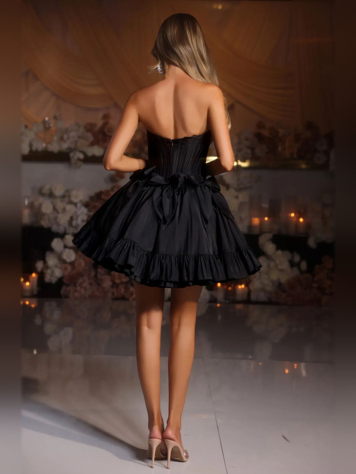 Black mini homecoming dress, back view showing the rear of the dress