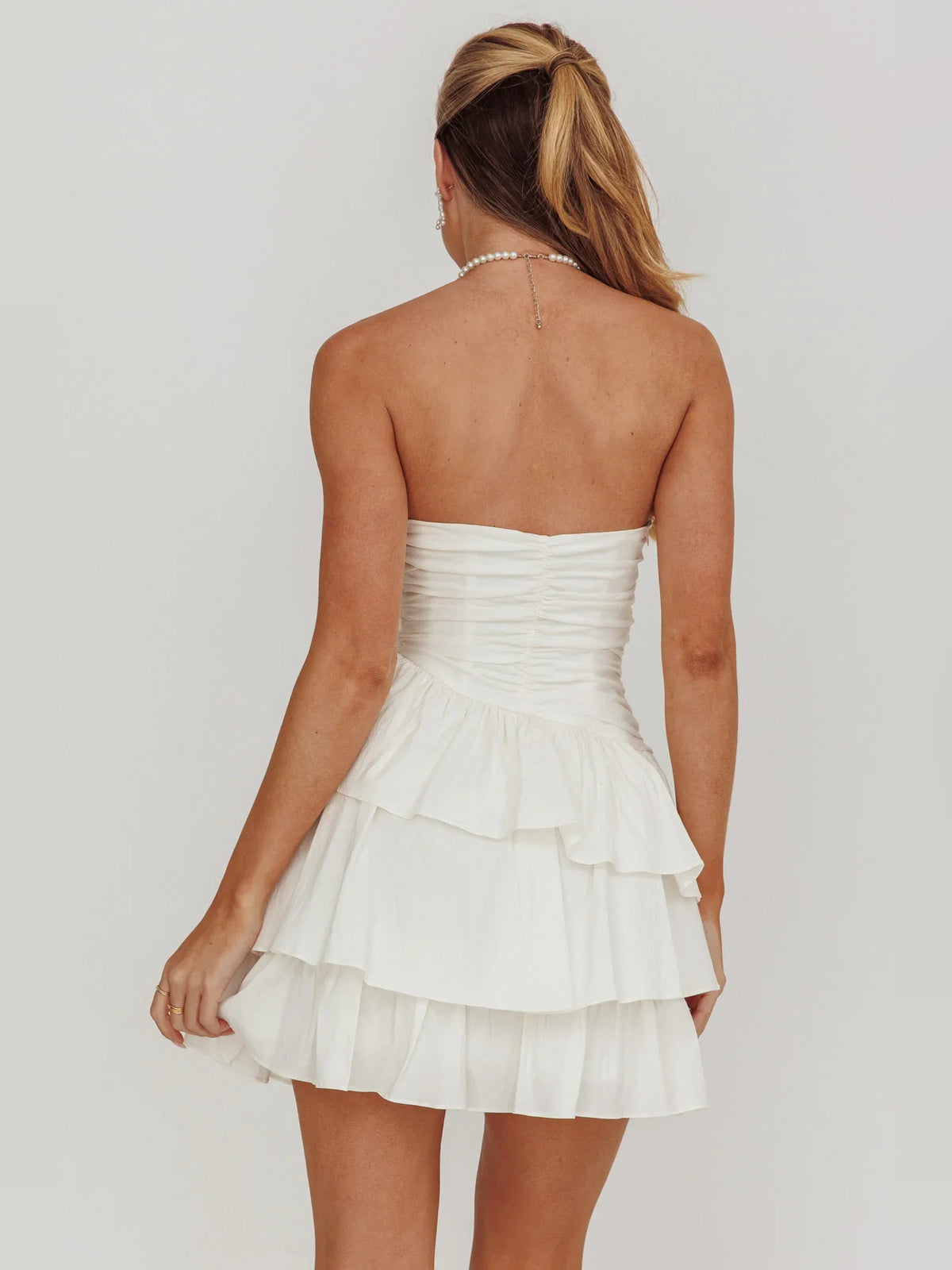 Ivory mini homecoming dress, back view showing the rear of the dress