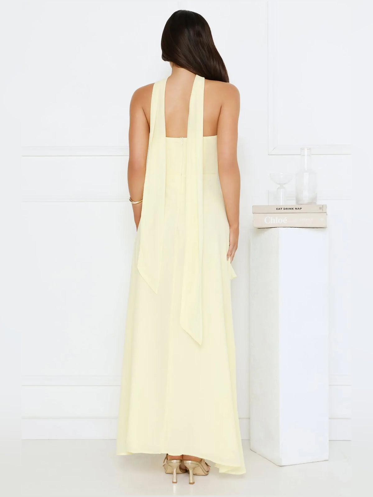 Yellow a-line maxi formal dress with tiered skirt, full-length back view