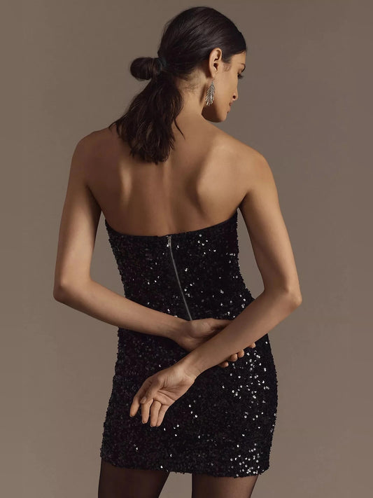 Black mini homecoming dress, back view showing the rear of the dress