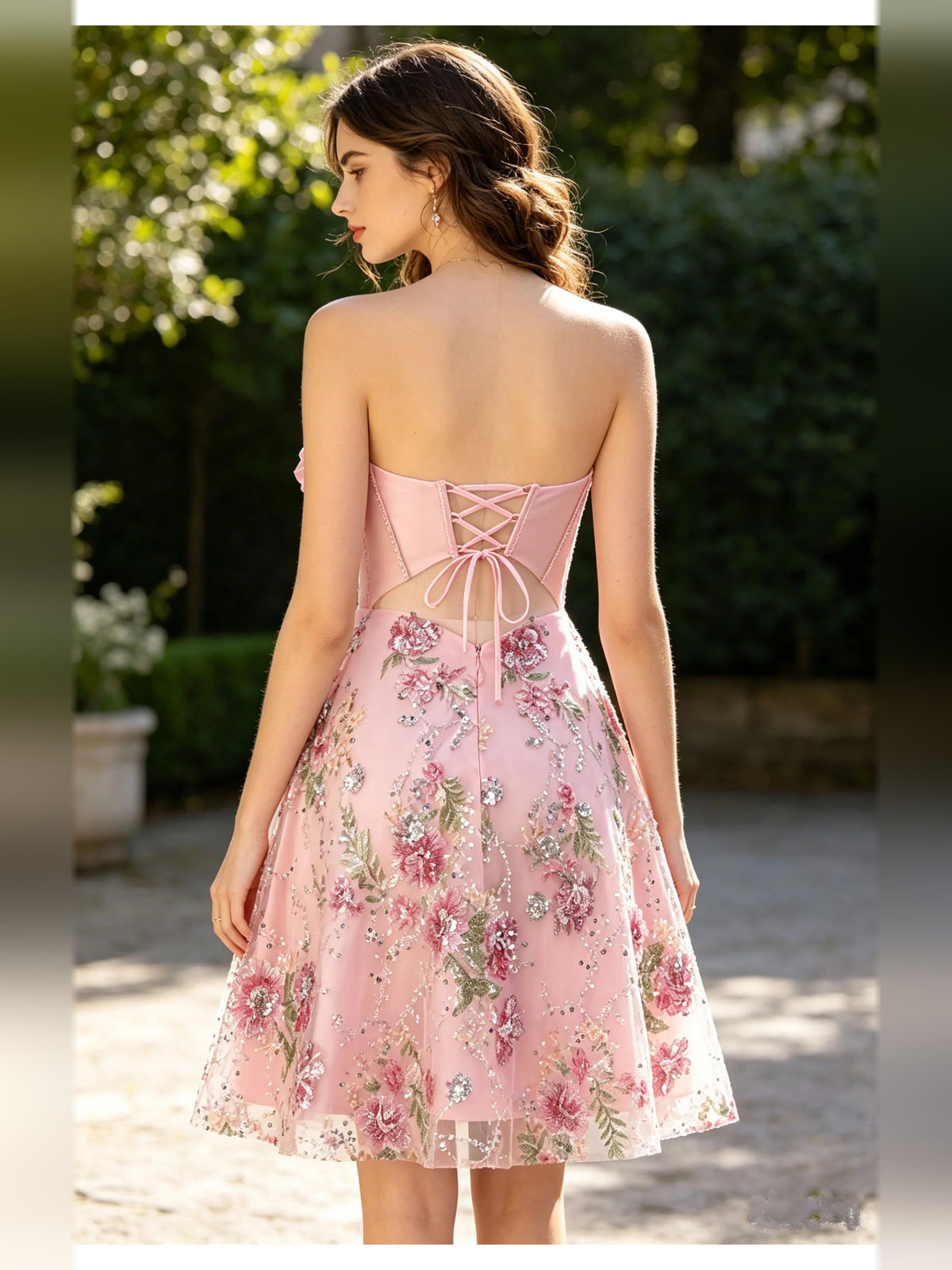 Light Pink short homecoming dress, back view showing the rear of the dress