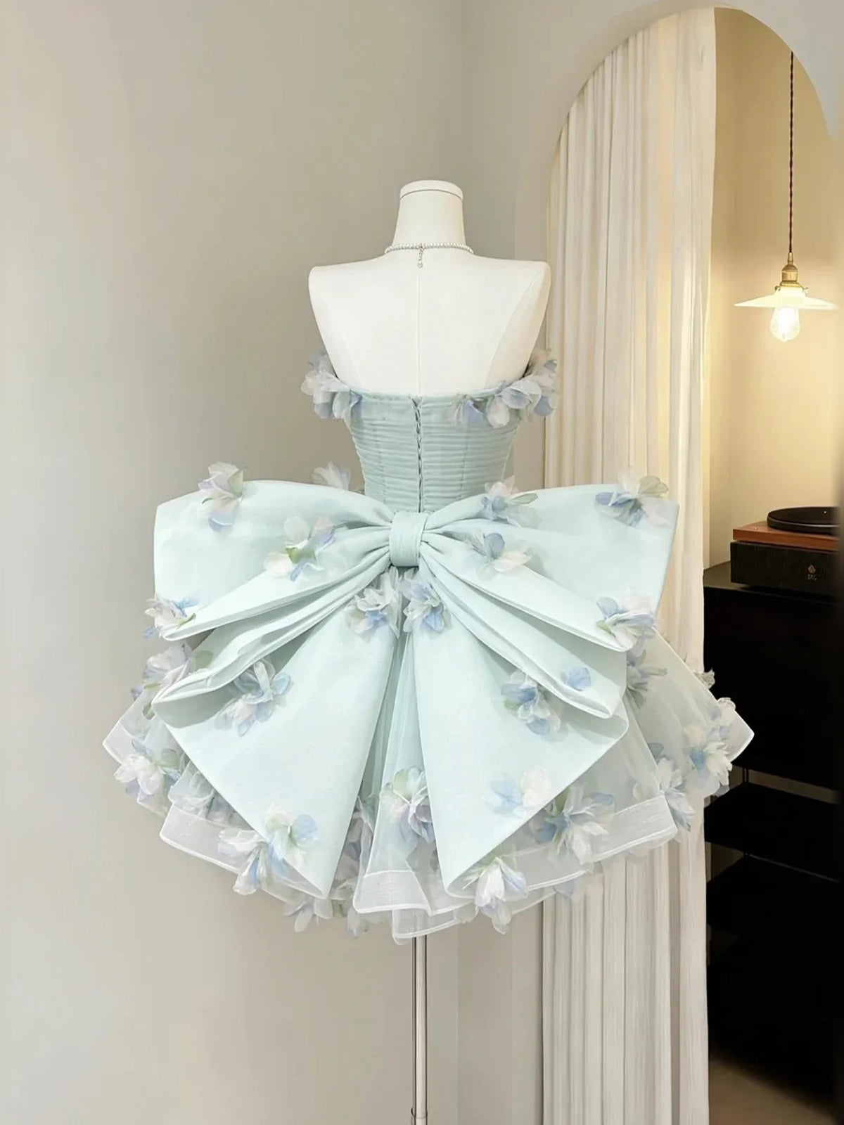 Ice Blue mini homecoming dress, back view showing the rear of the dress