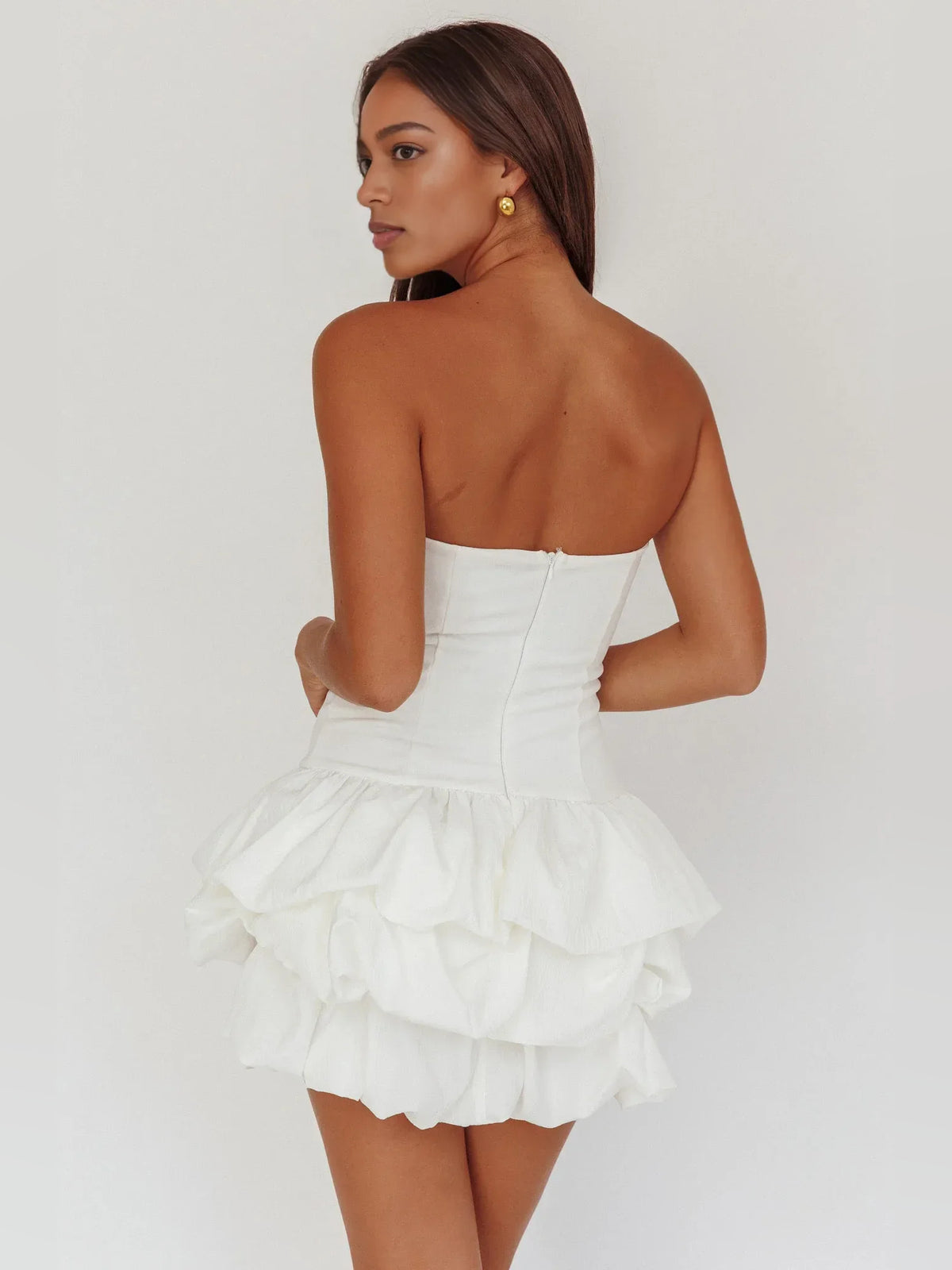 White mini homecoming dress, back view showing the rear of the dress
