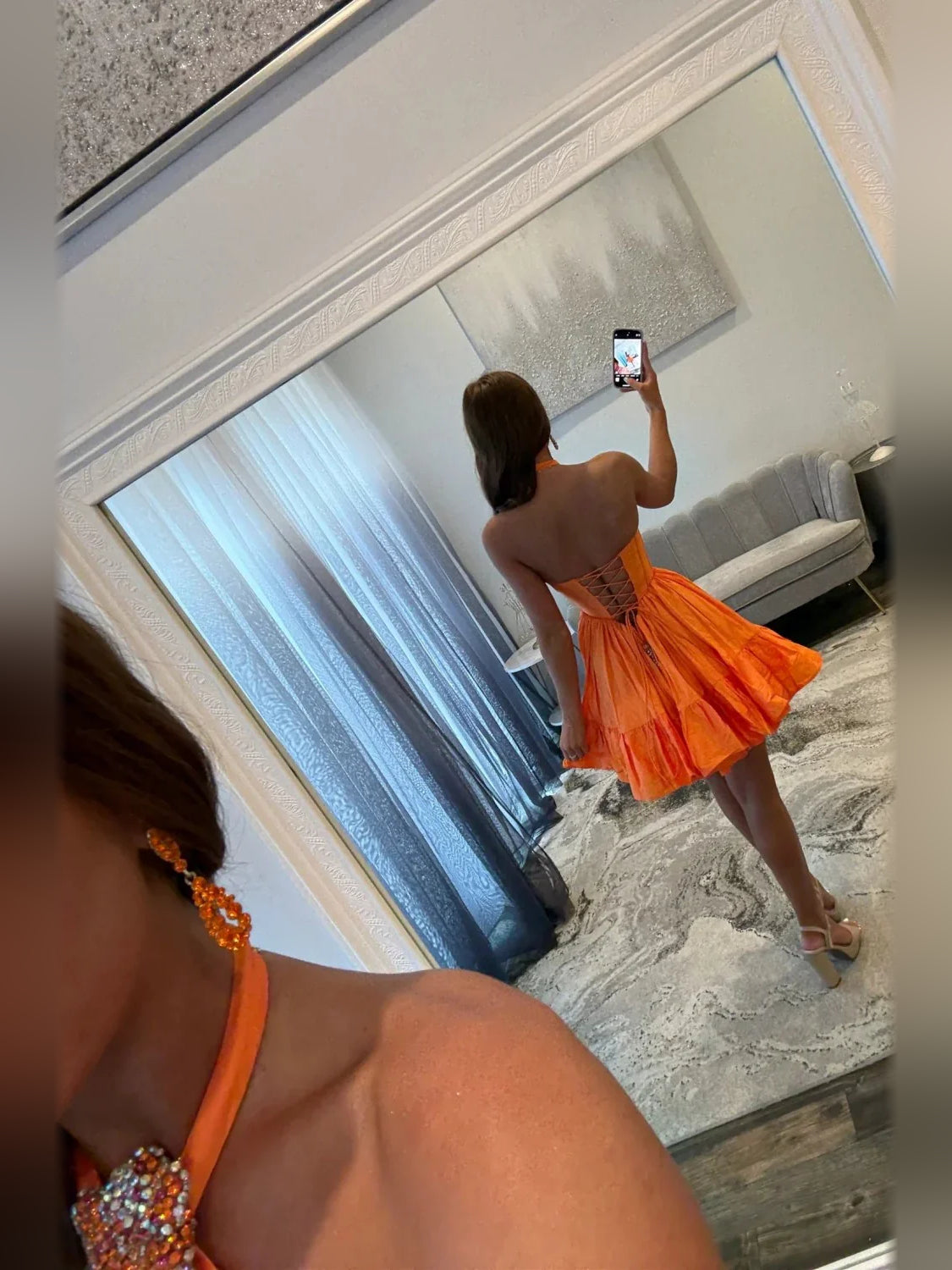 Orange mini homecoming dress, back view showing the rear of the dress