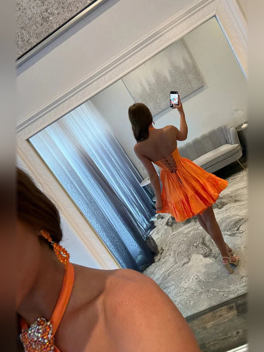 Orange mini homecoming dress, back view showing the rear of the dress