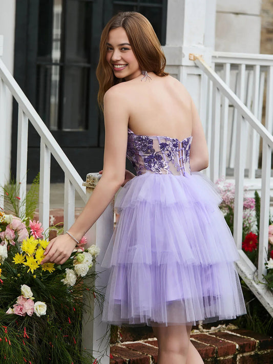 Lilac mini homecoming dress, back view showing the rear of the dress