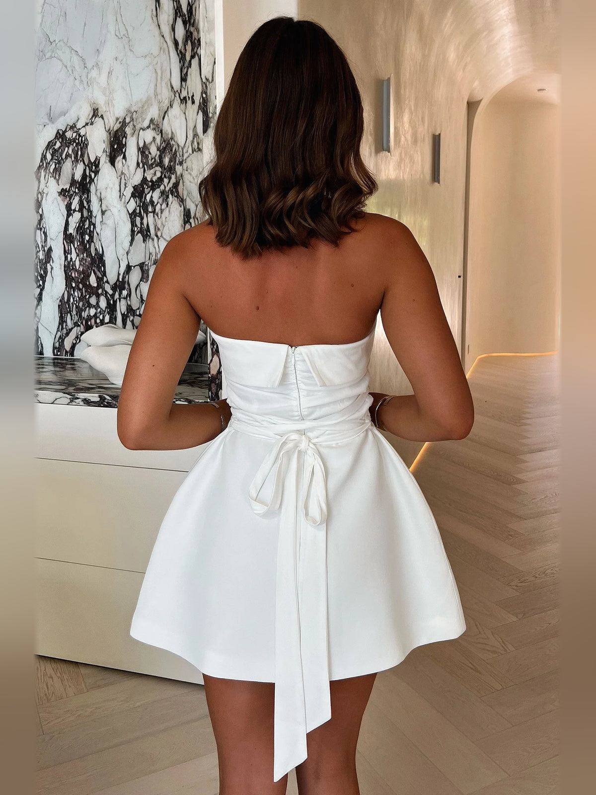 Ivory white mini homecoming dress, back view showing the rear of the dress