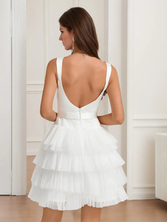 White mini homecoming dress, back view showing the rear of the dress
