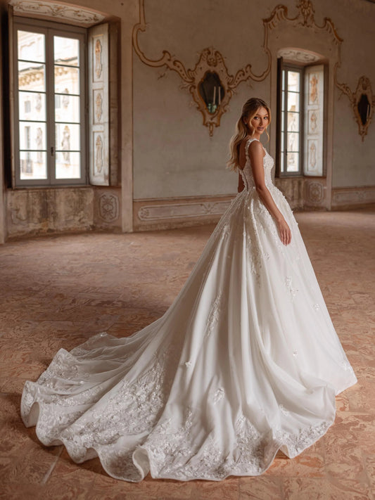 Ivory floor-length wedding dress, back view showing the rear of the dress