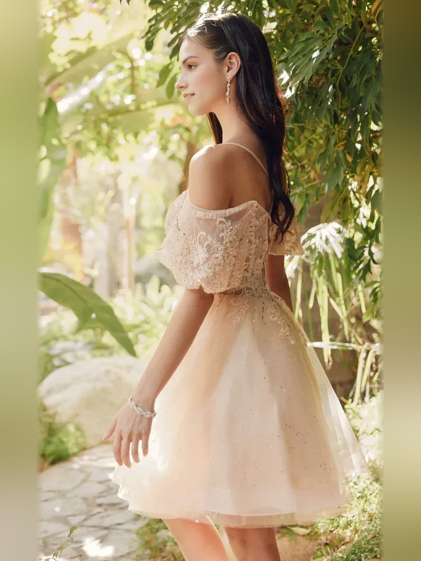 Champagne short homecoming dress, back view showing the rear of the dress