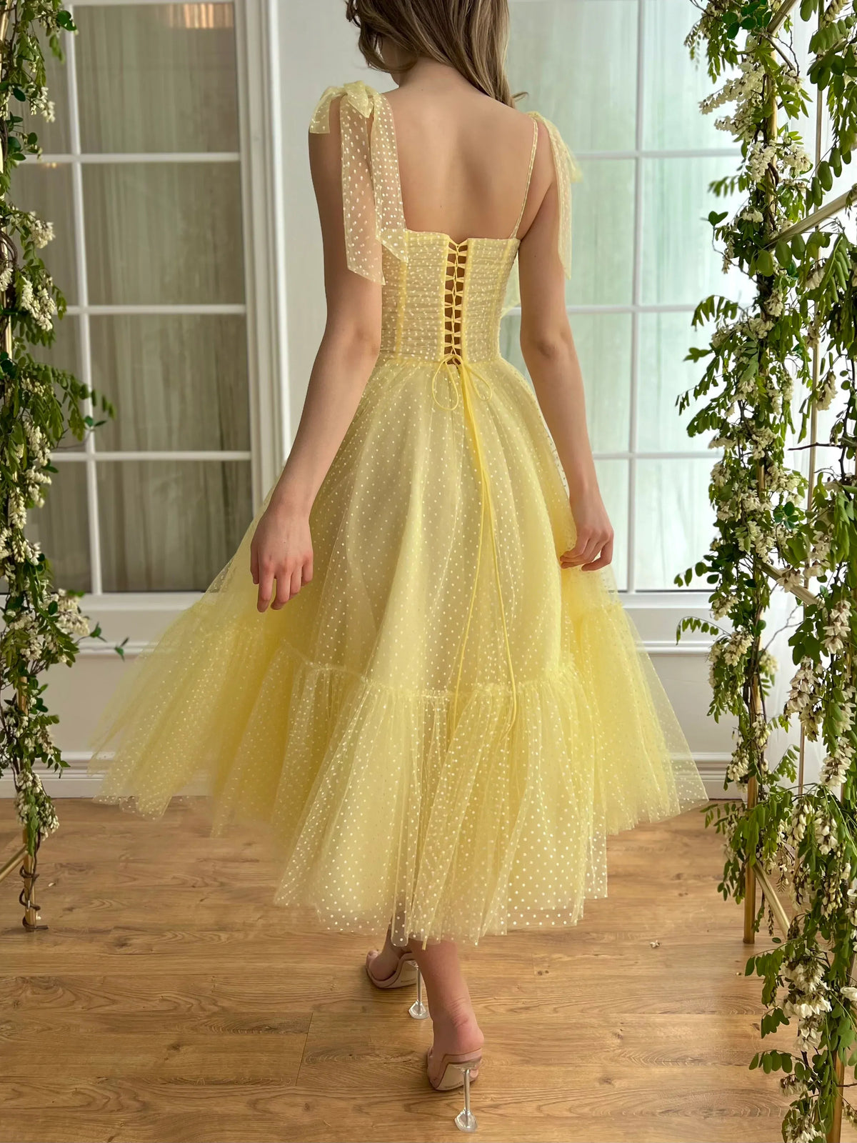 Yellow tea-length homecoming dress, back view showing the rear of the dress