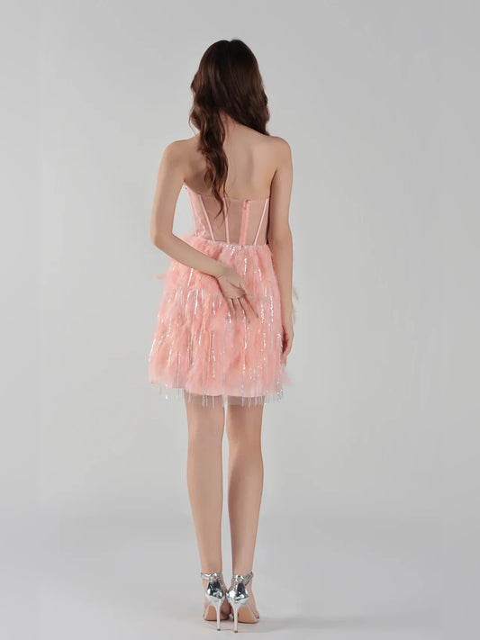 Coral mini homecoming dress, back view showing the rear of the dress