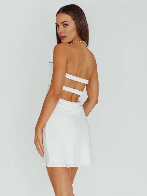 White mini homecoming dress, back view showing the rear of the dress