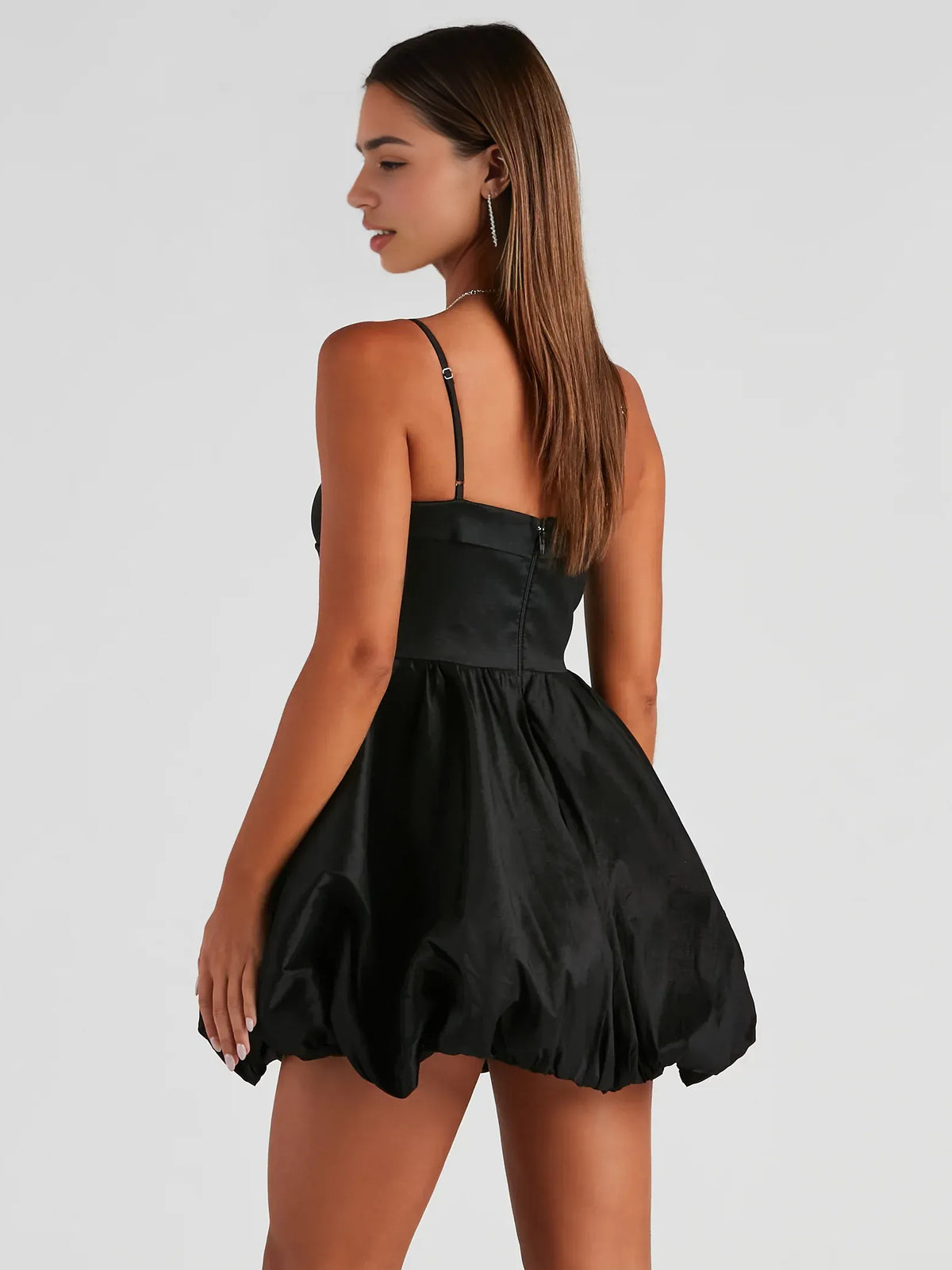 Black mini homecoming dress, back view showing the rear of the dress