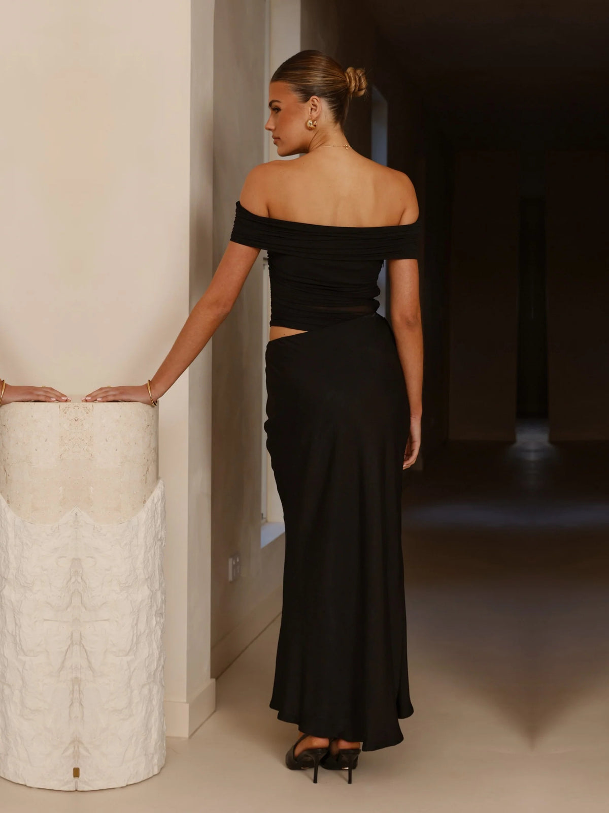 Black sheath maxi formal dress with ruching, full-length back view