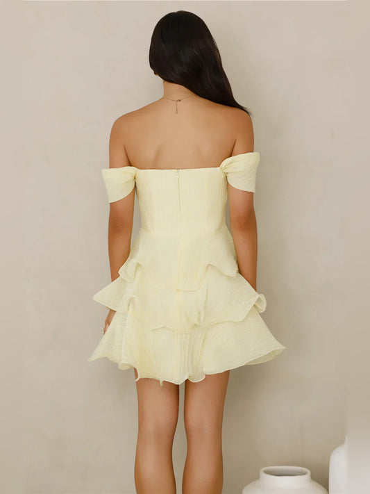 Yellow mini homecoming dress, back view showing the rear of the dress