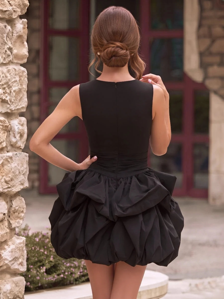 Black mini homecoming dress, back view showing the rear of the dress