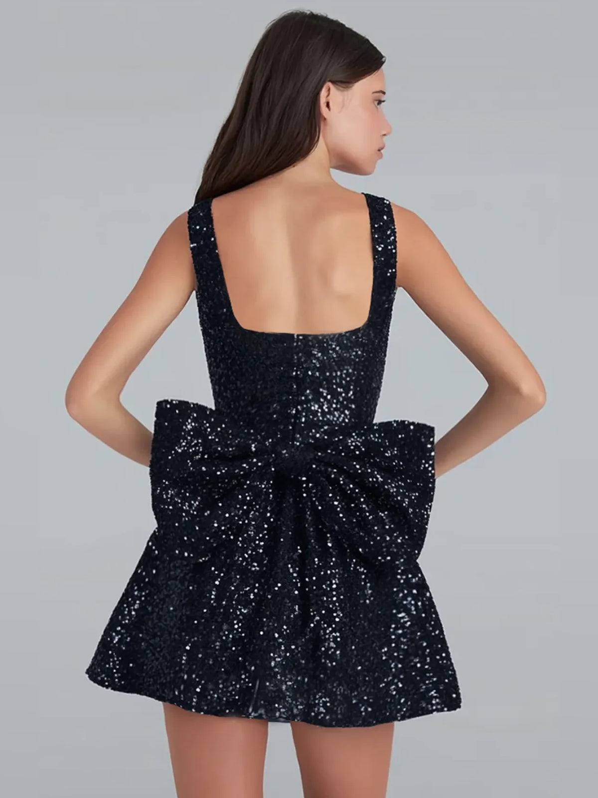 Black mini homecoming dress, back view showing the rear of the dress