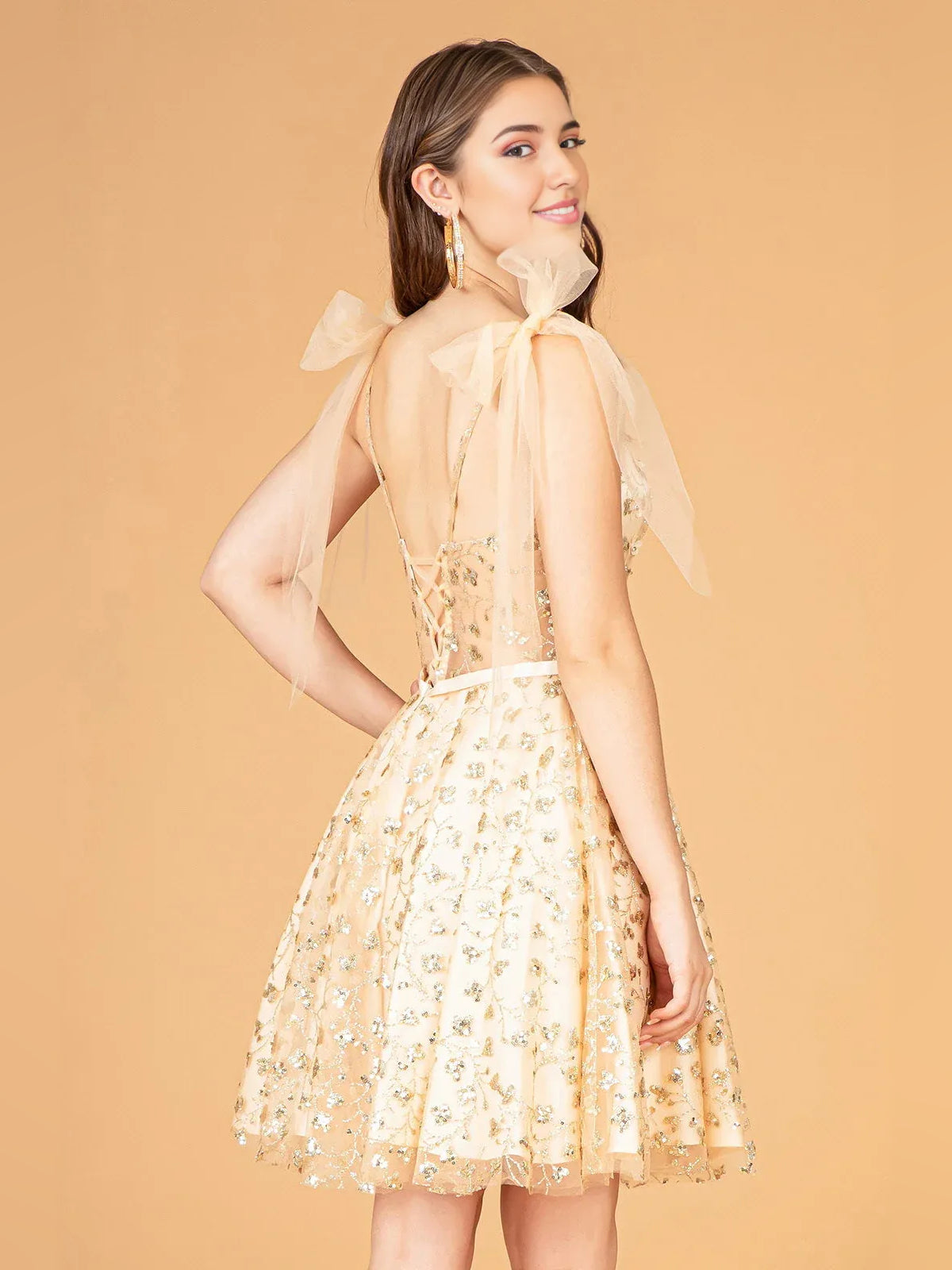 Champagne mini homecoming dress, back view showing the rear of the dress