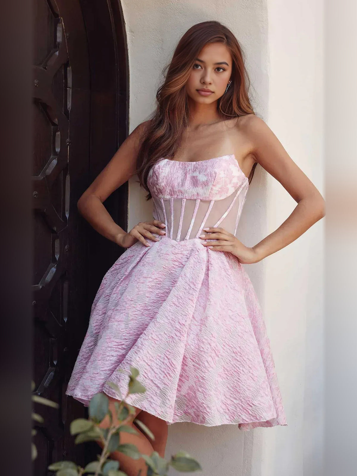 Pink short homecoming dress, back view showing the rear of the dress