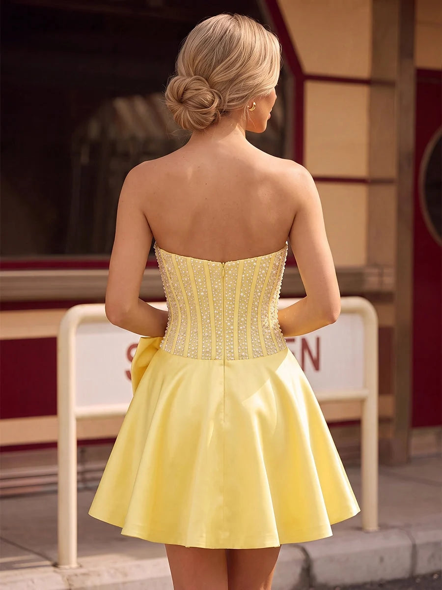 Lemon mini homecoming dress, back view showing the rear of the dress